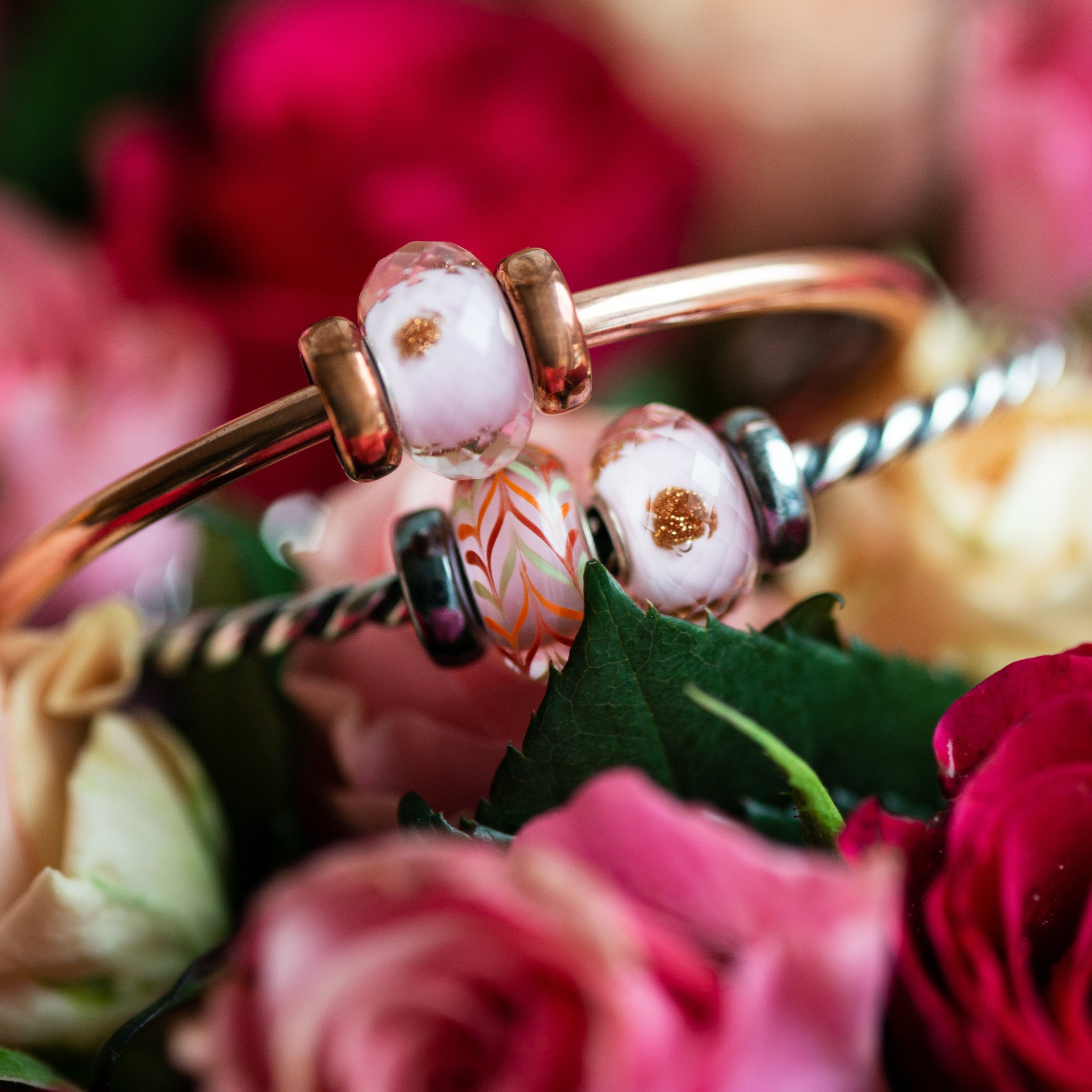 Copper and silver bangles with romantic pink glass beads